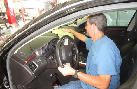 photo of man detailing car interior